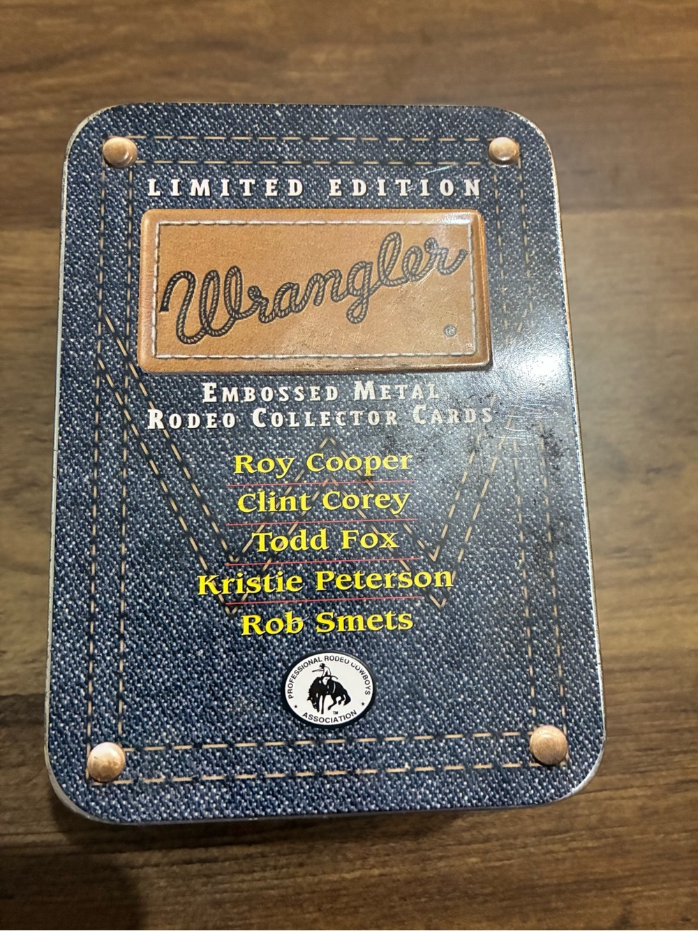 Wrangler Denim Blue Tin with Tan Leather Logo and Yellow Text